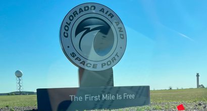 image of the large, round Colorado Air And Space Port Sign