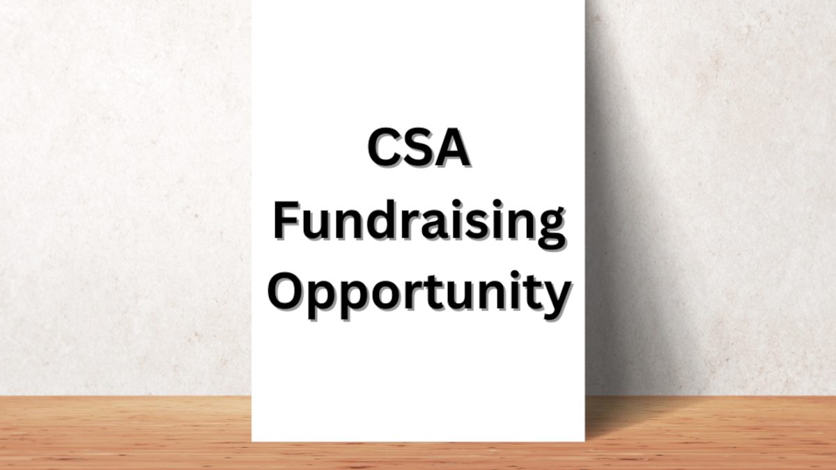 white sign that reads "CSA Fundraising Opportunity" in black text