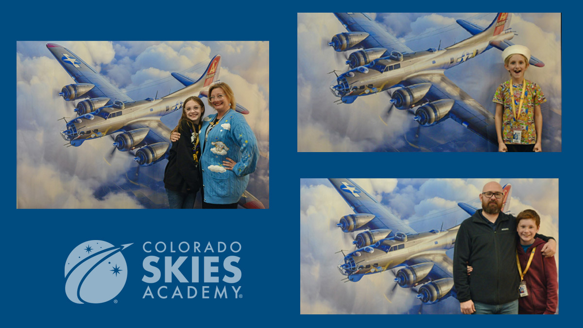 3 image of CSA learners and parents standing in front of a painted mural of a plane